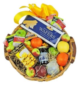 Fresh fruit selection includes Honey Crisp apples, Granny Smiths, seasonal pears and citrus combined with jelly, cracker, cheese, teas, cookies and candies.